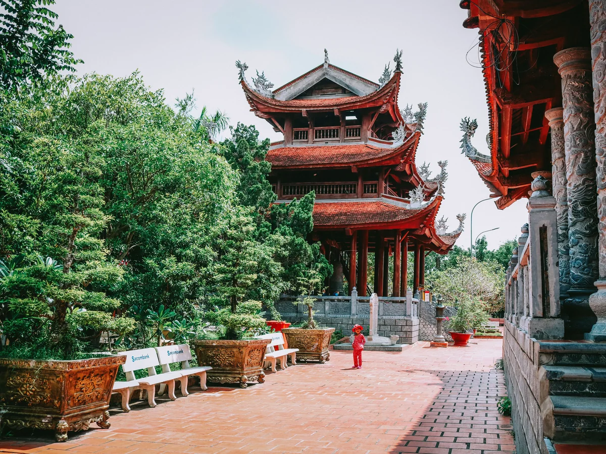 A multi-tier red-lacquered Vietnamese pagoda, representative of Mekong Delta pagoda architecture
